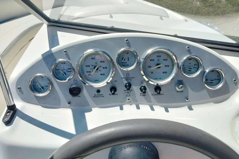 Slide: The Image of Dashboard of a 2007 Bayliner 175 Bowrider boat with gauges and controls. - 11