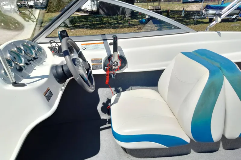 Slide: The Image of 2007 Bayliner 175 Bowrider interior with steering wheel and dashboard controls. - 16