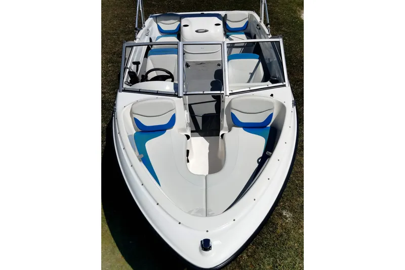 Slide: The Image of 2007 Bayliner 175 Bowrider boat with blue and white seating, viewed from above. - 21