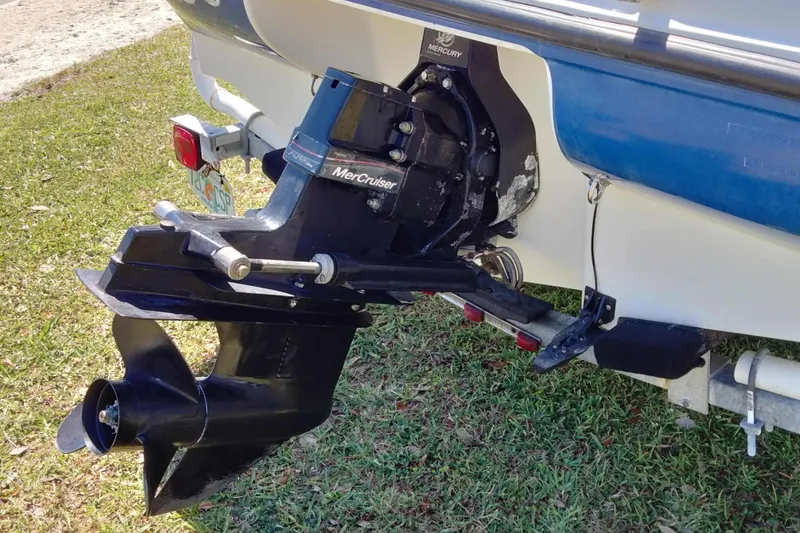 Slide: The Image of 2007 Bayliner 175 Bowrider with MerCruiser engine on grassy surface. - 4