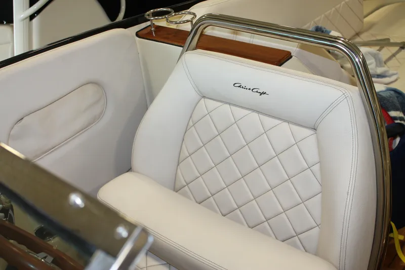 Slide: The Image of 2018 Chris-Craft Launch 34 interior with white quilted leather seating. - 24