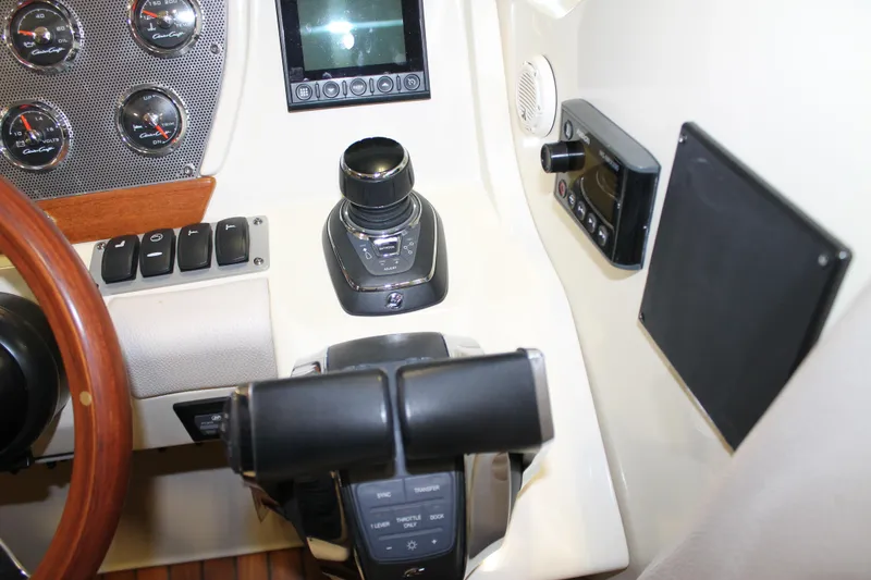 Slide: The Image of 2018 Chris-Craft Launch 34 dashboard with controls and gauges. - 32