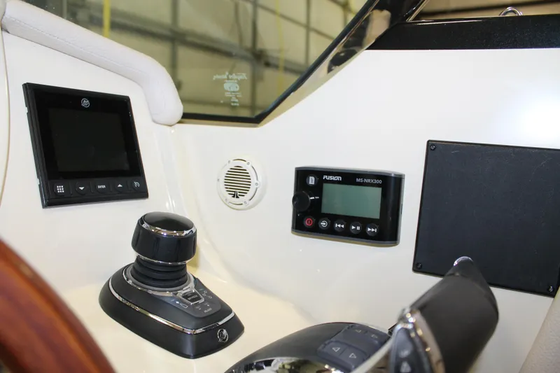 Slide: The Image of Control panel of a 2018 Chris-Craft Launch 34 boat with navigation and audio systems. - 33