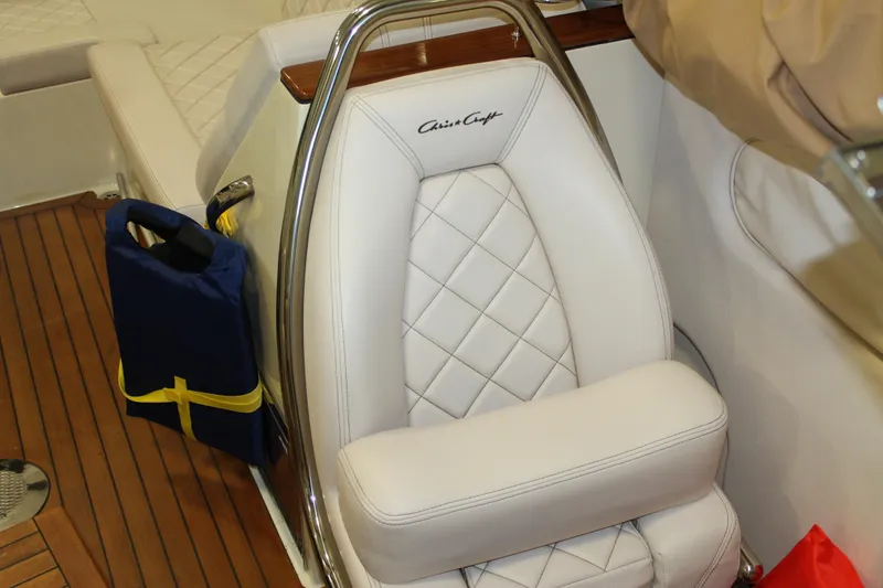 Slide: The Image of Luxurious white leather seat on 2018 Chris-Craft Launch 34 boat with wooden flooring. - 36