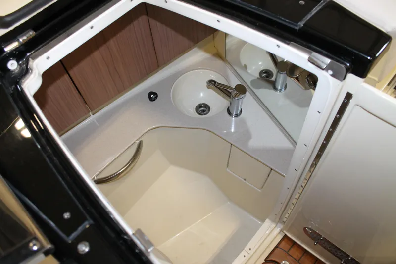 Slide: The Image of 2018 Chris-Craft Launch 34 interior bathroom with sink and mirror. - 37