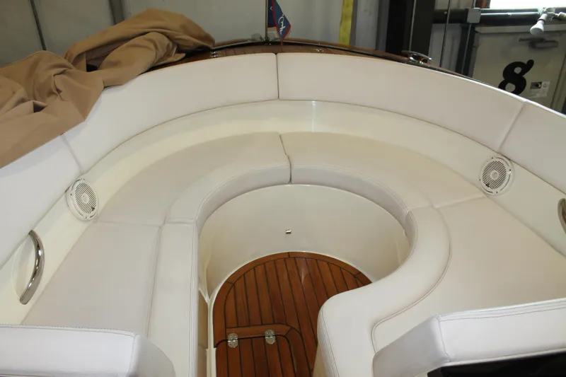 Slide: The Image of 2018 Chris-Craft Launch 34 interior with white seating and teak flooring. - 41