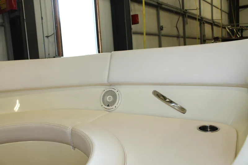 Slide: The Image of Interior seating of 2018 Chris-Craft Launch 34 boat with speaker and cup holder. - 44