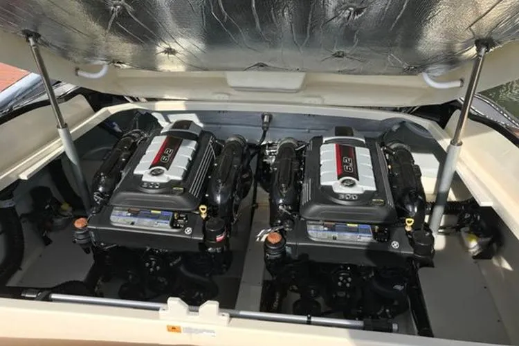 Slide: The Image of Twin engines in a 2018 Chris-Craft Launch 34 boat, showcasing powerful performance. - 48