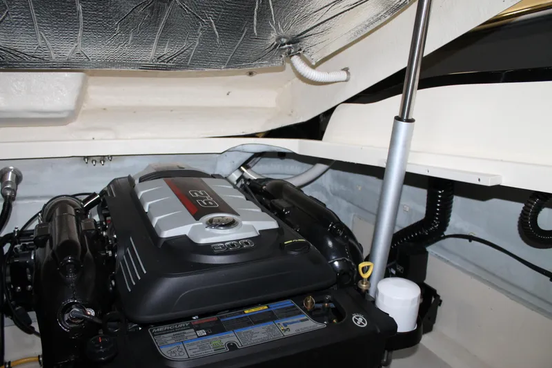 Slide: The Image of Engine compartment of a 2018 Chris-Craft Launch 34 boat, featuring a Mercury engine. - 50