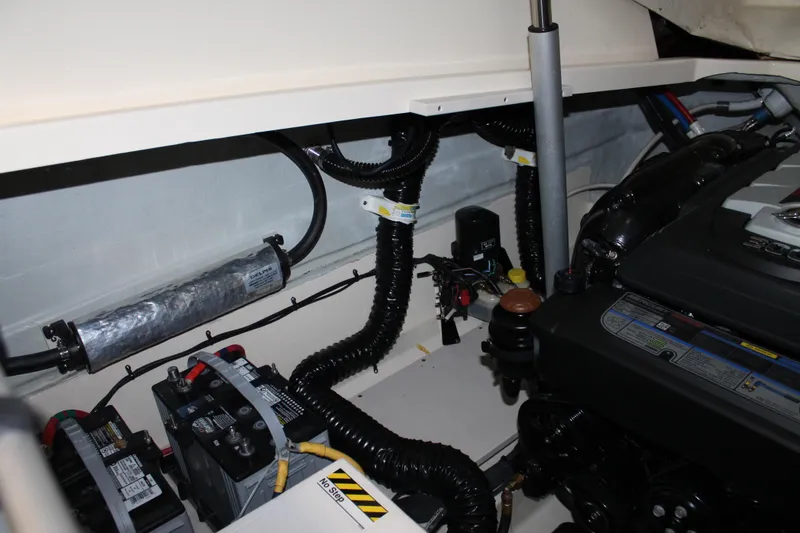 Slide: The Image of Engine compartment of a 2018 Chris-Craft Launch 34 boat, showcasing mechanical components. - 52