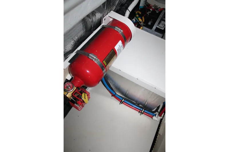 Slide: The Image of Engine compartment of 2018 Chris-Craft Launch 34 with fire extinguisher and wiring. - 53