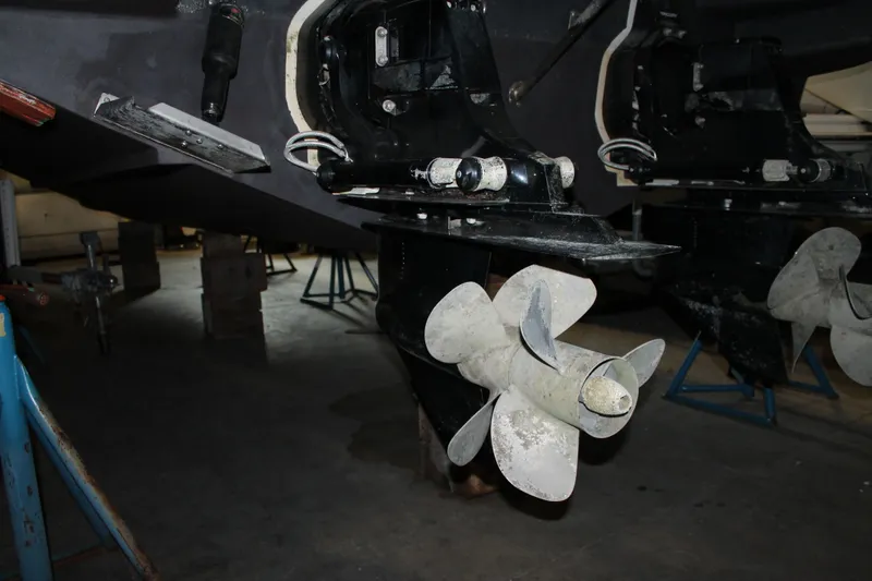 Slide: The Image of 2018 Chris-Craft Launch 34 boat propellers in a maintenance setting. - 56