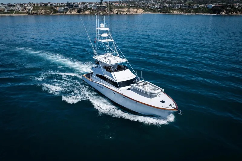 Slide: The Image of Engine room of a 1993 Lydia Sportfisher boat, showcasing dual engines and mechanical components. - 11