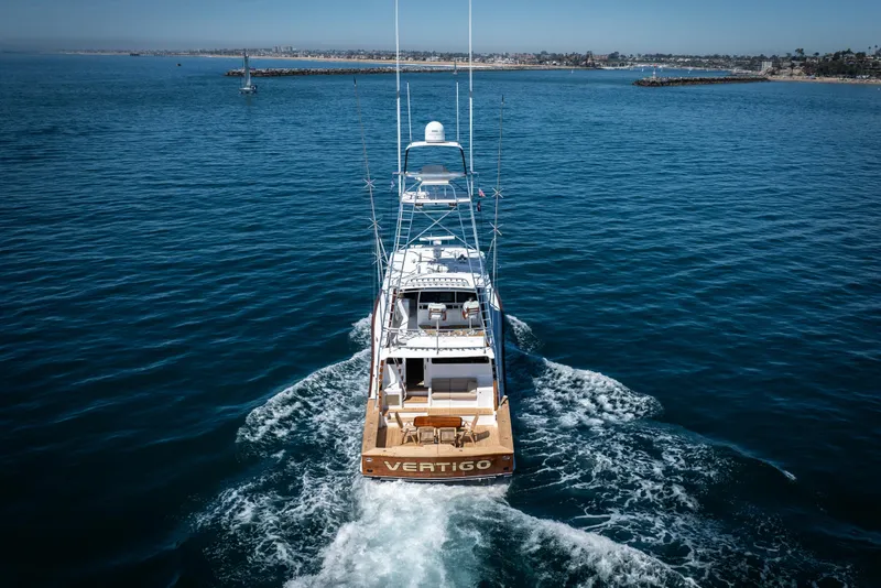 Slide: The Image of Aerial view of 1993 Lydia Sportfisher yacht deck with wooden table and chairs. - 15