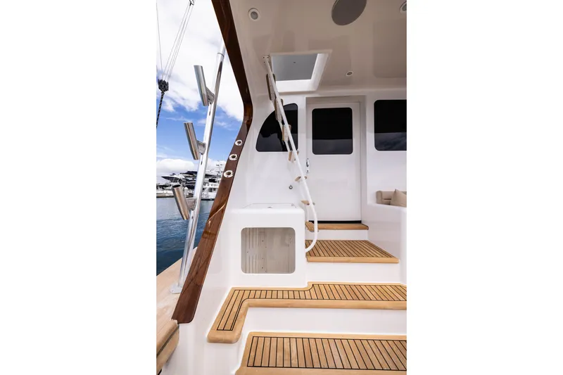 Slide: The Image of Luxurious interior of a 1993 Lydia Sportfisher yacht with wood paneling and scenic windows. - 16