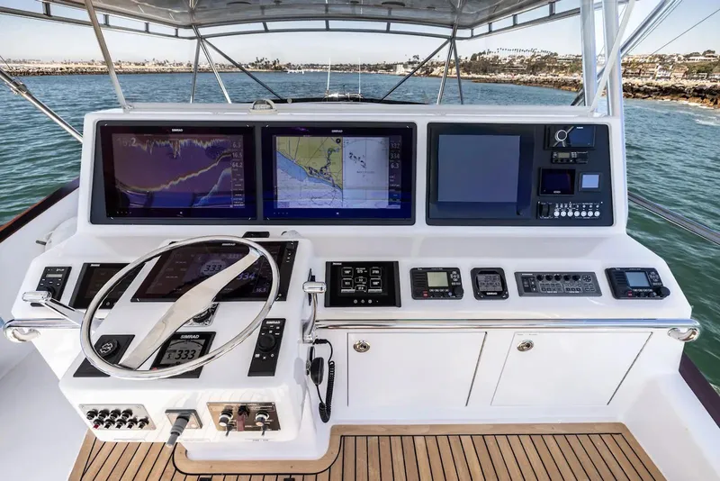 Slide: The Image of Luxurious 1993 Lydia Sportfisher yacht kitchen with modern appliances and elegant wood cabinetry. - 22