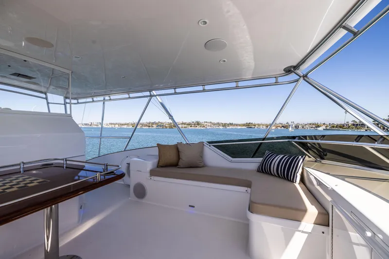 Slide: The Image of Luxurious interior of a 1993 Lydia Sportfisher yacht with elegant seating and marina view. - 23