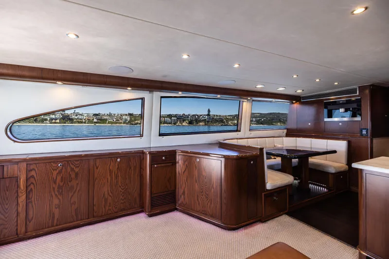 Slide: The Image of Luxurious interior of a 1993 Lydia Sportfisher yacht with leather seating and marina view. - 26