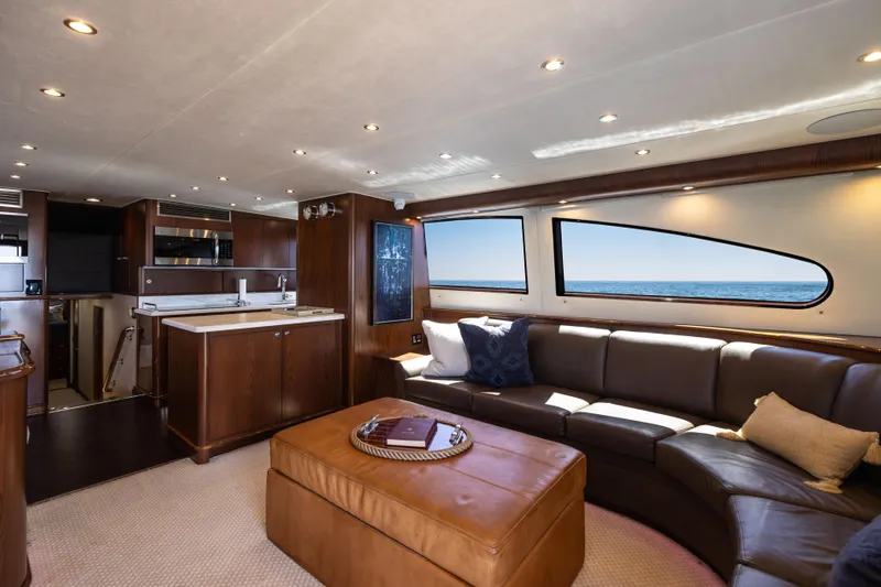 Slide: The Image of Luxurious interior of a 1993 Lydia Sportfisher yacht with leather seating and marina view. - 27
