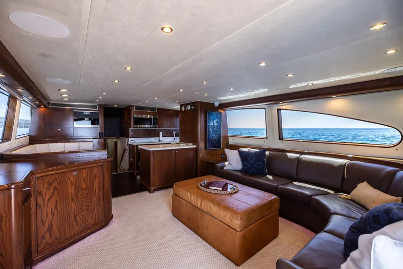 Slide: The Image of Luxurious cabin interior of a 1993 Lydia Sportfisher yacht with wood paneling and cozy bedding. - 28