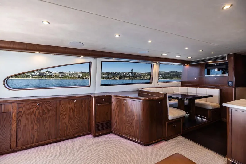 Slide: The Image of Luxurious 1993 Lydia Sportfisher yacht interior with wood paneling and modern amenities. - 30