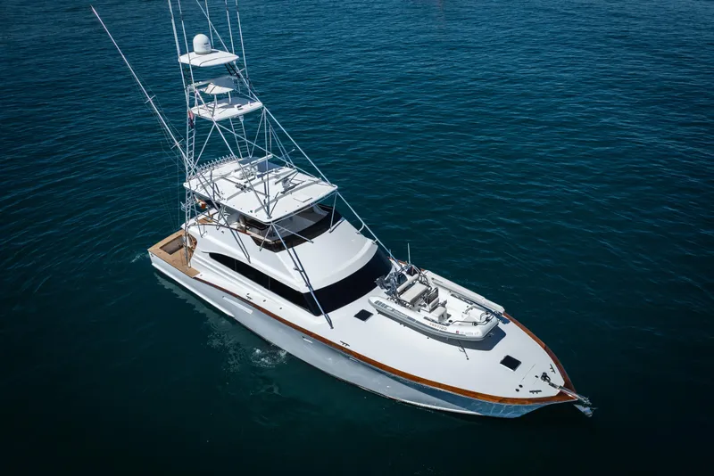 Slide: The Image of Engine room of a 1993 Lydia Sportfisher boat, showcasing dual engines and mechanical systems. - 9