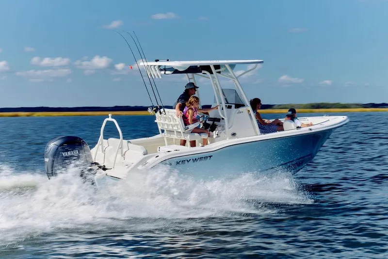 Slide: The Image of 2026 Key West 219 FS boat cruising on open water with passengers onboard. - 3