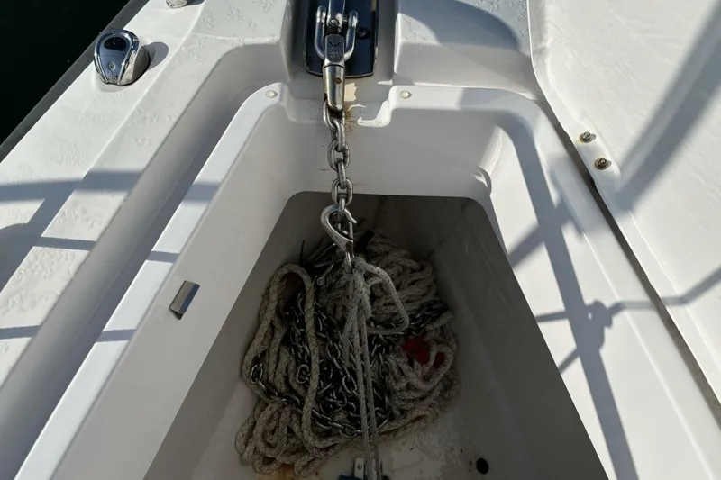 Slide: The Image of Anchor chain and rope in storage compartment of 2019 Axopar 28 Cabin boat. - 28