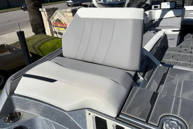 Slide: The Image of 2021 Supra SE 550 boat interior with gray seating and modern design. - 12