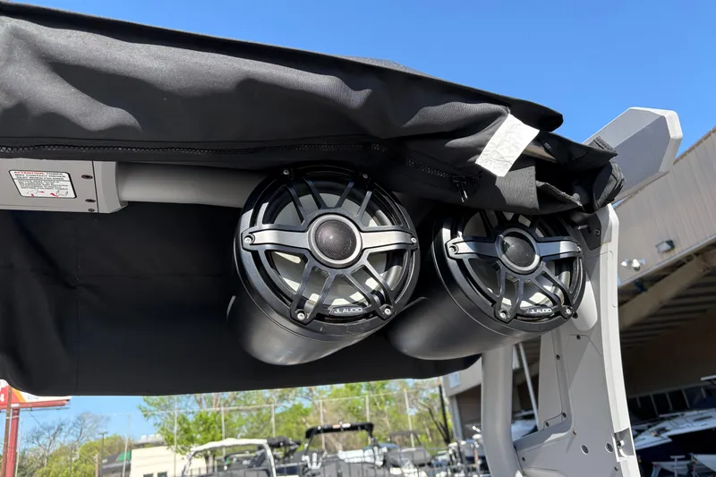Slide: The Image of 2021 Supra SE 550 boat speakers under canopy, clear blue sky background. - 17
