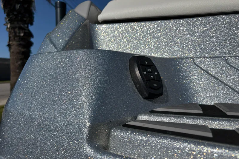 Slide: The Image of 2021 Supra SE 550 boat with glittery silver finish and control panel. - 9