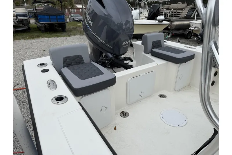 Slide: The Image of 2026 May-Craft 182 boat with Yamaha 90 engine, featuring cushioned seating and storage compartments. - 3