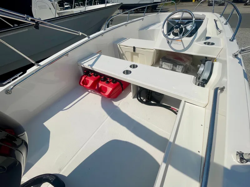 Slide: The Image of The image shows the cockpit of a Boston Whaler 160 Super Sport boat. - 3