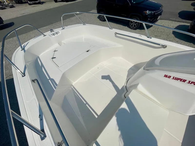 Slide: The Image of The image shows the deck of a 2026 Boston Whaler 160 Super Sport boat. - 9