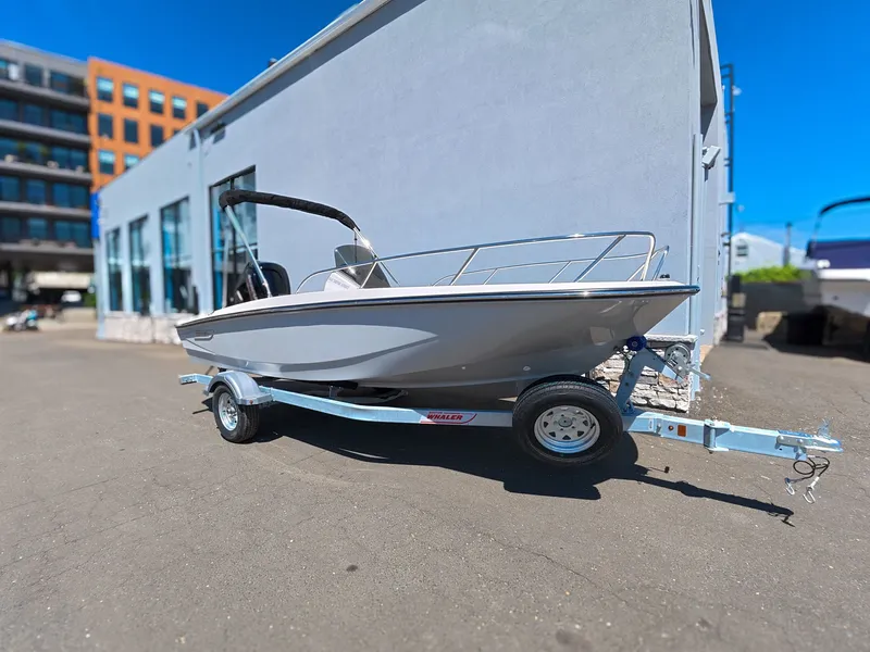 Slide: The Image of Boston Whaler 160 Super Sport 2026 on calm water with passengers. - 22