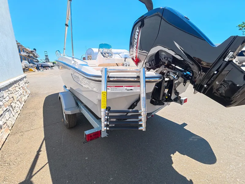 Slide: The Image of Boston Whaler 160 Super Sport 2026 on calm waters under blue sky. - 25