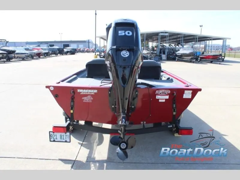 Slide: The Image of Red Pro 170 boat from 2022 with 50 HP motor on parking lot. - 7