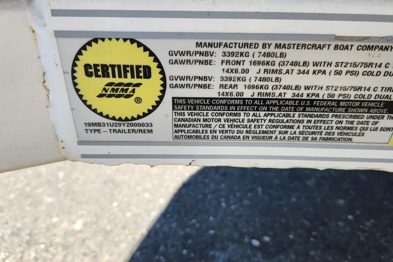 Slide: The Image of Certified NMMA label on 2000 MasterCraft Prostar 205 trailer, displaying weight specifications. - 6