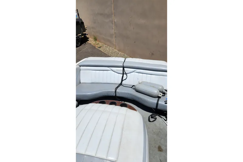 Slide: The Image of Interior of a 2000 MasterCraft Prostar 205 boat with white seating. - 8