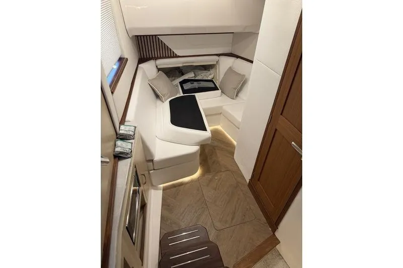 Slide: The Image of Luxurious interior of 2025 Regal LX43 yacht with elegant seating and wooden accents. - 18