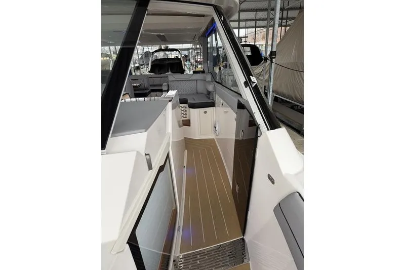 Slide: The Image of Interior view of 2025 Regal LX43 boat, featuring sleek design and modern seating. - 20