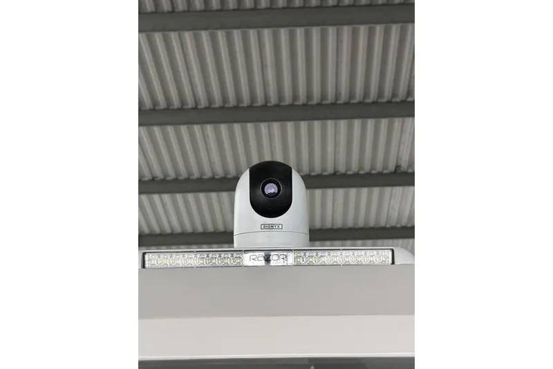 Slide: The Image of Security camera mounted on a ceiling, Regal LX43 model, 2025. - 21