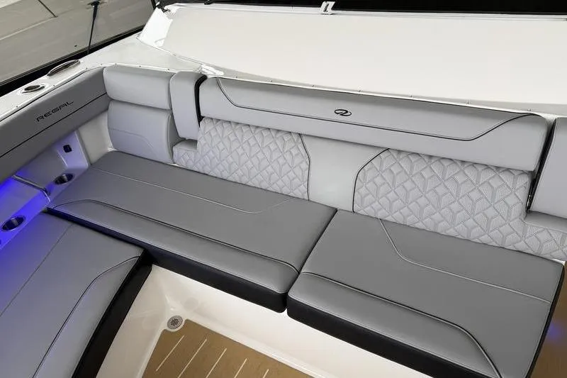 Slide: The Image of Luxurious seating on 2025 Regal LX43 boat with elegant gray upholstery and quilted design. - 24