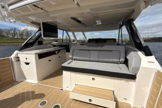 Slide: The Image of Luxurious 2025 Regal LX43 boat interior with modern seating and sleek design. - 33