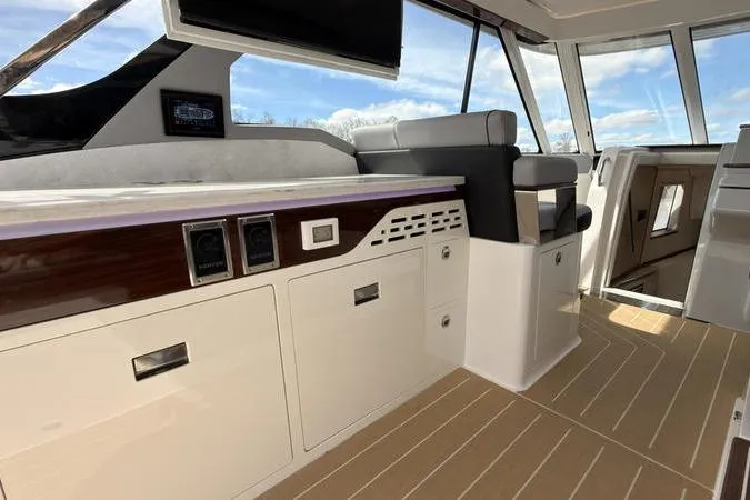 Slide: The Image of Luxurious interior of 2025 Regal LX43 yacht with modern seating and cabinetry. - 40