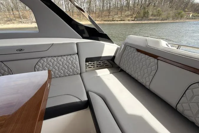 Slide: The Image of Luxurious seating area on a 2025 Regal LX43 boat, featuring elegant quilted upholstery. - 41
