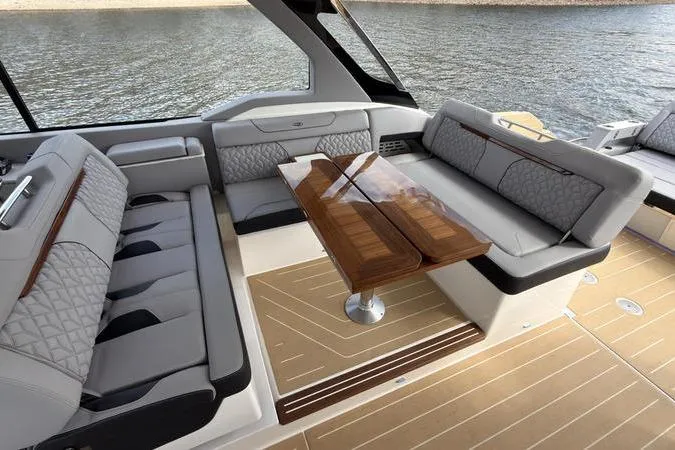 Slide: The Image of Luxurious interior of 2025 Regal LX43 yacht with elegant seating and wooden table. - 44