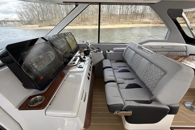 Slide: The Image of Luxurious interior of 2025 Regal LX43 yacht with modern navigation system. - 45