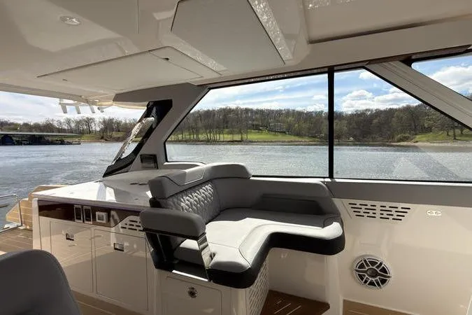 Slide: The Image of Luxurious interior of 2025 Regal LX43 yacht with scenic water view. - 56