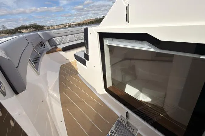 Slide: The Image of 2025 Regal LX43 yacht interior with sleek seating and modern design. - 67